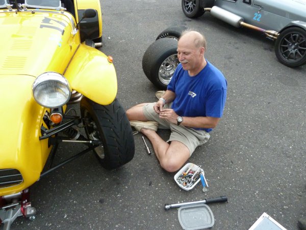 Changing tires after a bolt punctures the brand new slicks.