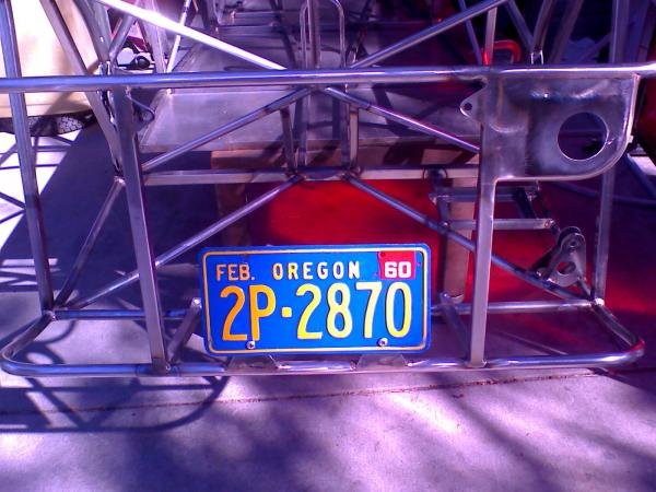 An original 1960 Oregon plate complete with it's metal plate shows how the same 7" center-to-center spare tire mounts double as the license plate mount when I leave the spare at home.