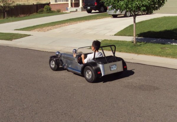 My son cruising around the neighborhood.  Car has a top speed of 20-mph.