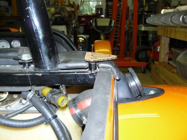 This picture shows that the welded bungs are high enough that the plate bolts up fine without crushing the leather.