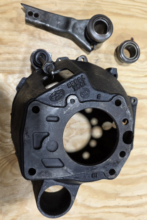 Lotus 7 bell housing with shift fork and to bearing.jpg
